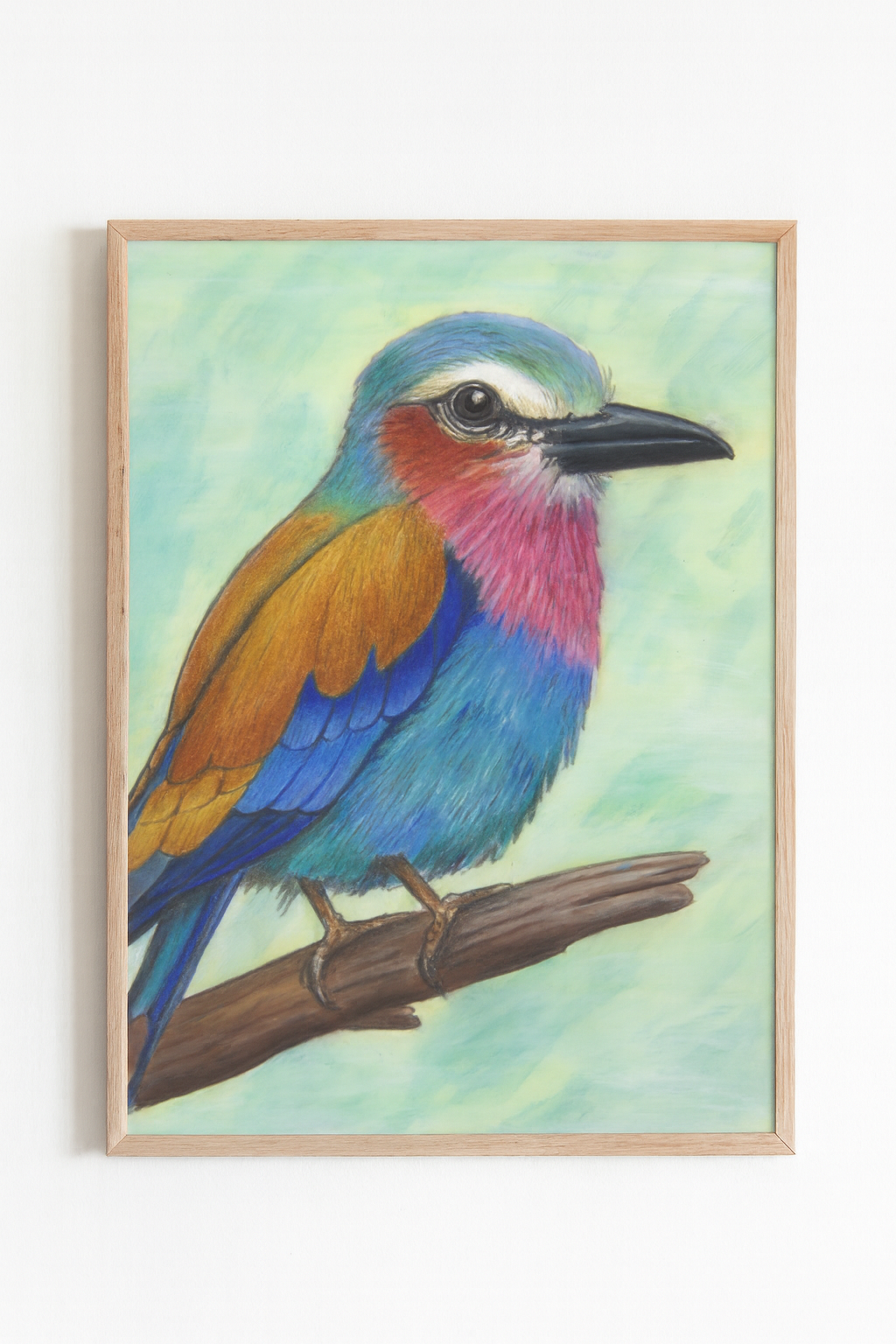 Framed painting of a colorful bird on a branch with a light green background